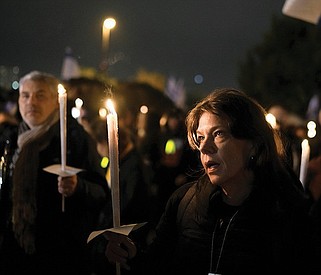 Relatives and friends of hostages held in the Gaza Strip by the Hamas militant group hold candles and call for their release during the Jewish holiday of Hanukkah, in Jerusalem on Dec. 12. Monday marks the first anniversary of the terrorist attack, which left roughly 1,200 people dead, with numerous others taken as hostages.
(AP/Leo Correa)