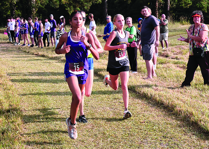 El Dorado's Jazmine Aguirre (15) holds the lead during the Wildcat Invitational at South Arkansas Regional Airport this season. Aguirre, a freshman, moved from Van Buren and has taken the lead in the Lady Wildcats' senior high group of runners.