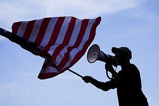 A counter protester yells at demonstrators during a rally near the Democratic National Convention in Chicago in this Aug. 22, 2024, file photo. (AP/Julio Cortez)