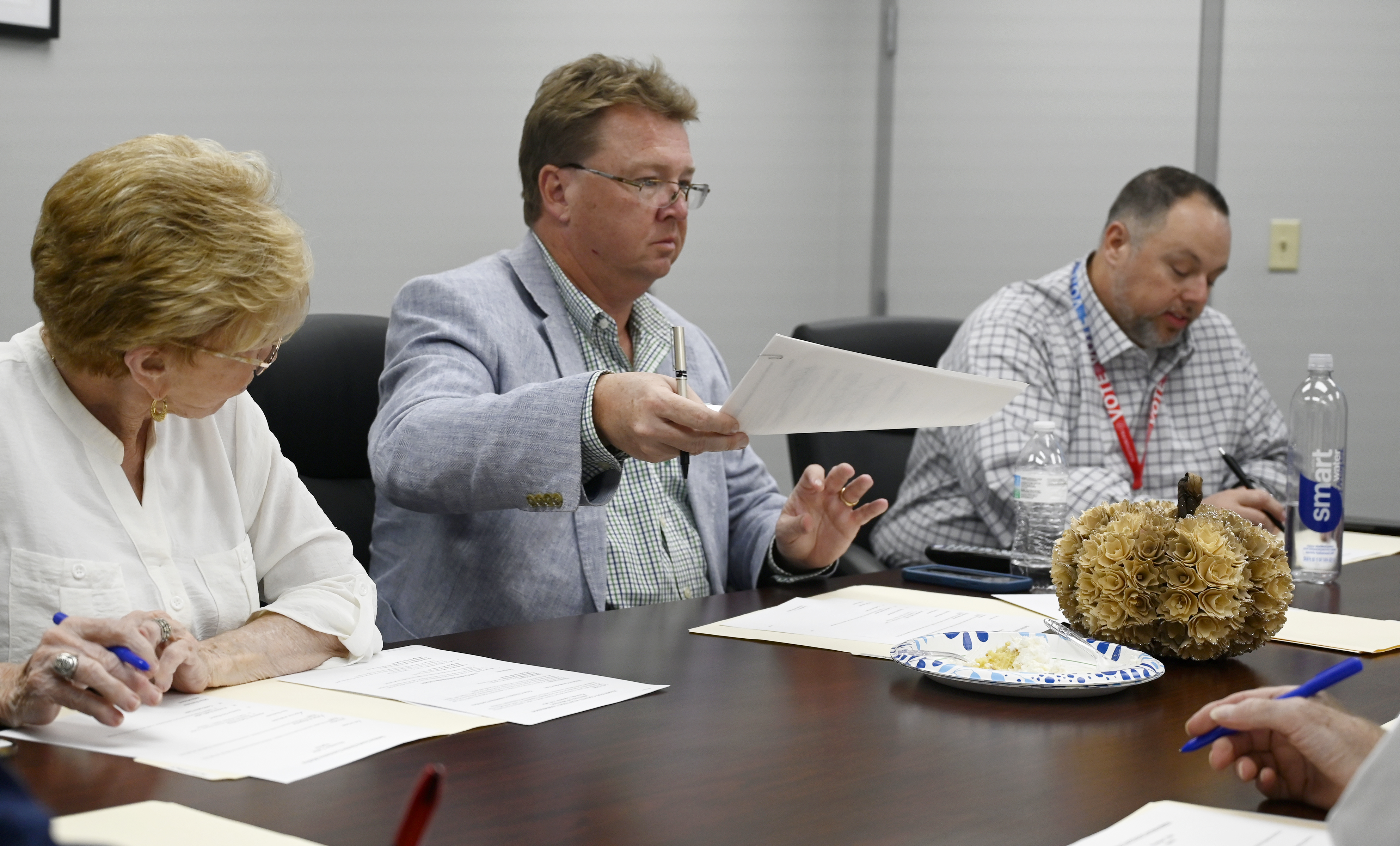 Staff photo by Abby White / Ruth Braly, left, Chris Clem, and Scott Allen discuss voting during the meeting. The Hamilton County election commission held a meeting shortly before the polls closed on Tuesday, November 5, 2024.