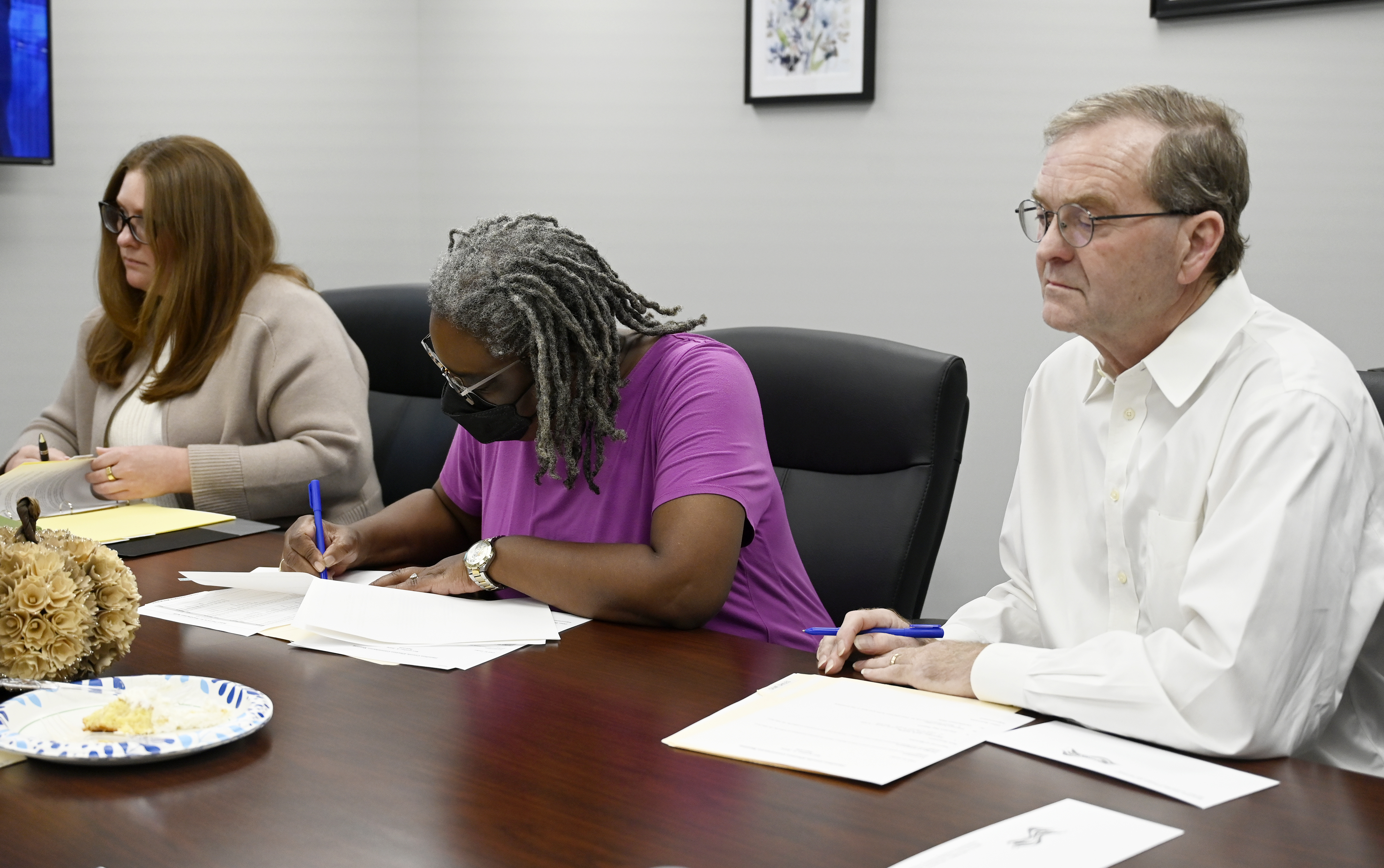Staff photo by Abby White / Kathleen Siciliano, left, Adrena Garth-Hicks, and Gene Shiles discuss voting during the meeting. The Hamilton County election commission held a meeting shortly before the polls closed on Tuesday, November 5, 2024.