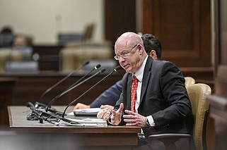 Booth Rand, general counsel for the Arkansas Insurance Department, fields questions from legislators Monday during the House and Senate Committee on Insurance and Commerce joint meeting at the state Capitol..(Arkansas Democrat-Gazette/Staci Vandagriff)