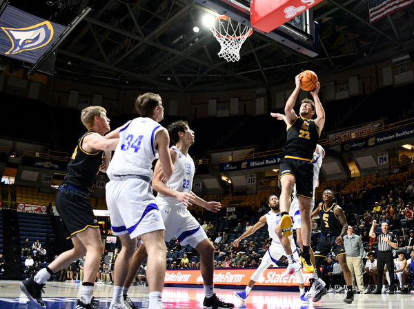 Staff Photo by Robin Rudd / UTC’s Bash Wieland (22) pulls down an offensive rebound. The University of Tennessee at Chattanooga Mocs hosted the Tennessee Wesleyan Bulldogs at McKenzie Arena on December 18, 2024.