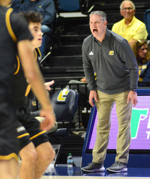 Staff Photo by Robin Rudd / UTC head coach Dan Earl calls instructions to the Mocs. The University of Tennessee at Chattanooga Mocs hosted the Tennessee Wesleyan Bulldogs at McKenzie Arena on December 18, 2024.