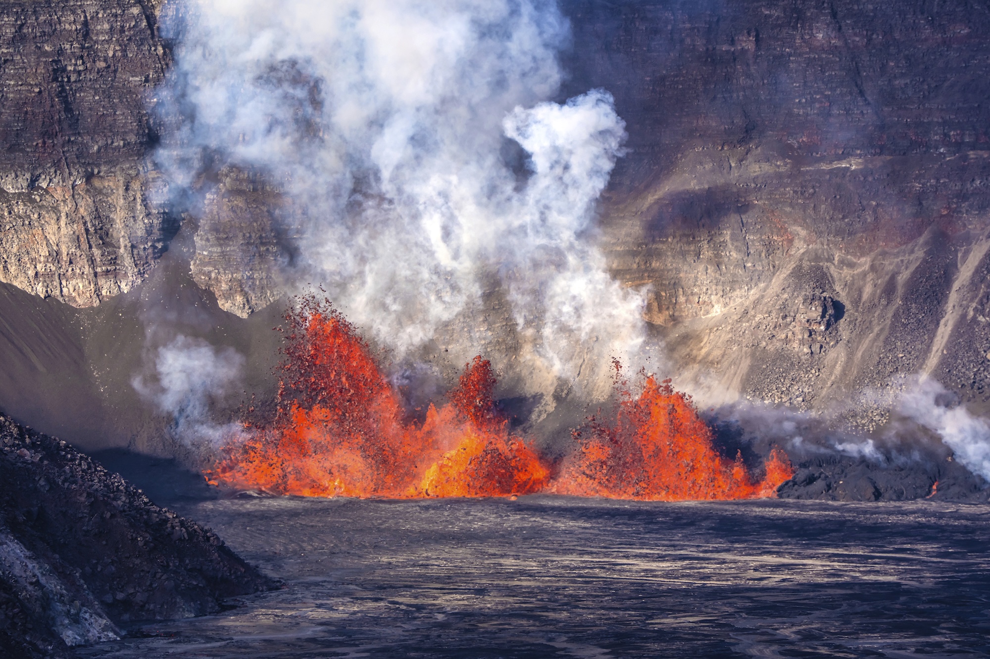 In this photo provided by the National Park Service, an eruption takes place on the summit of the Kilauea volcano in Hawaii, Monday, Dec. 23, 2024. (Janice Wei/NPS via AP)