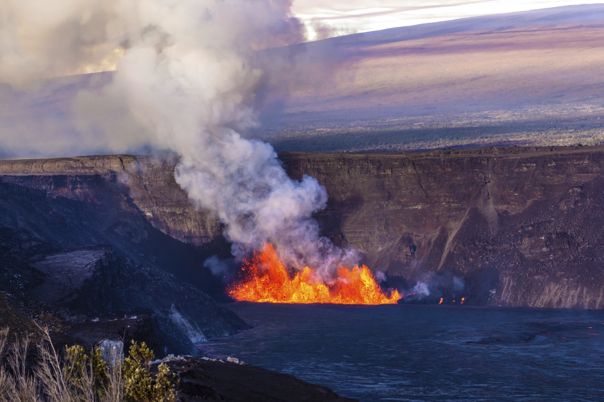 In this photo provided by the National Park Service, an eruption takes place on the summit of the Kilauea volcano in Hawaii, Monday, Dec. 23, 2024. (Janice Wei/NPS via AP)