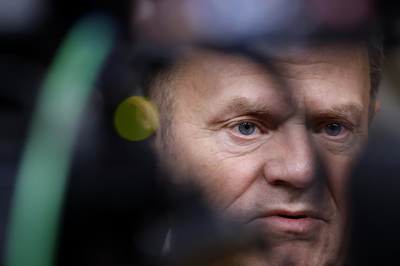 Poland's Prime Minister Donald Tusk speaks with the media prior to a group photo at an EU summit in Brussels, Thursday, Dec. 19, 2024. (AP Photo/Omar Havana)