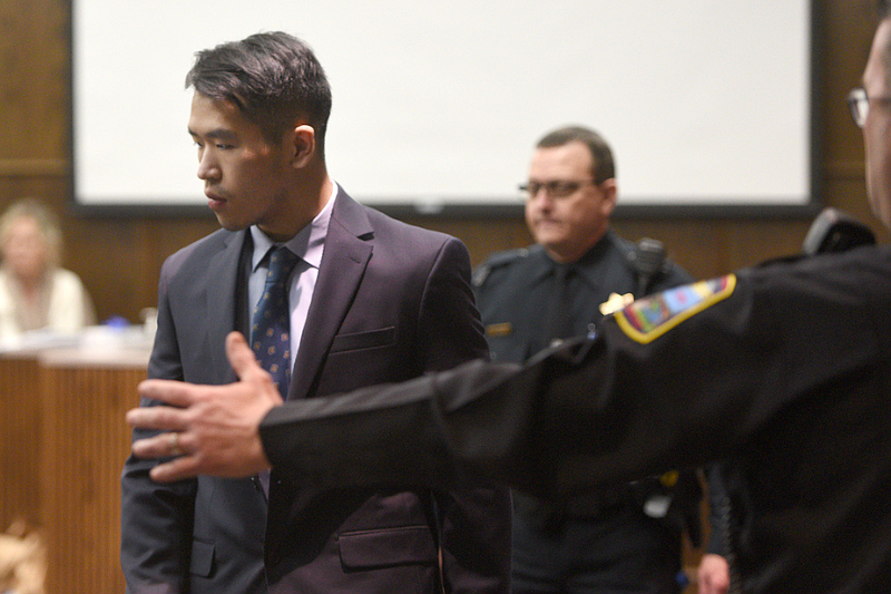 Staff photo by Matt Hamilton/ An officer directs Jason Chen as he enters the courtroom at the Hamilton County Courts Building on Thursday, January 16, 2025.