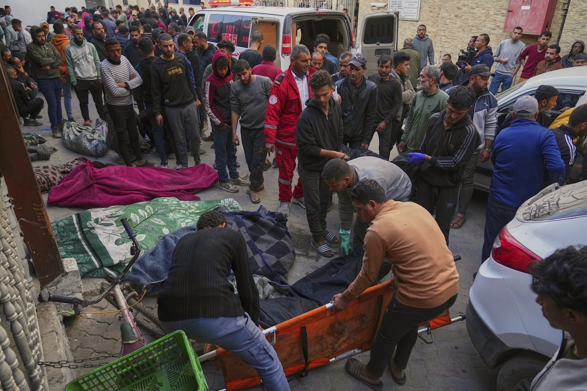 Bodies of people killed during overnight Israeli army airstrikes across the Gaza Strip are left in the yard of the the Al-Ahli hospital in Gaza City, Tuesday, March 18, 2025. (AP Photo/Jehad Alshrafi)