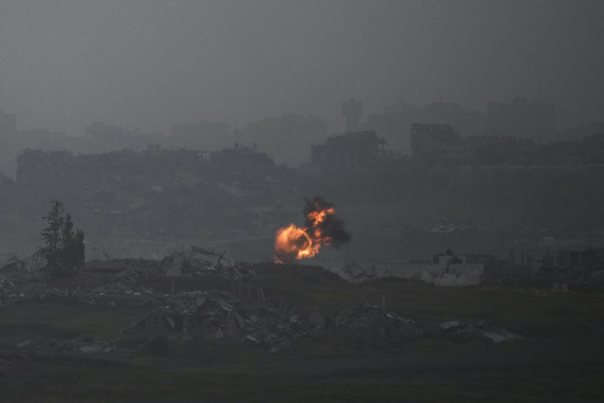 An explosion erupts in the northern Gaza Strip, as seee from southern Israel, on Tuesday, March 18, 2025. (AP Photo/Leo Correa)