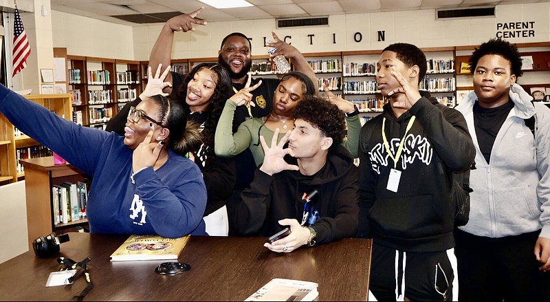 Watson Chapel High School students react and take a selfie after reading one of Phyllis Hodges’ books adopted into the school’s curriculum. The Watson Chapel School District recently purchased copies of “8 Years of Unforgettable History,” chronicling the presidency of Barack Obama, and “Girl Power,” which honors leading ladies in entertainment, government and culture. (Special to The Commercial)