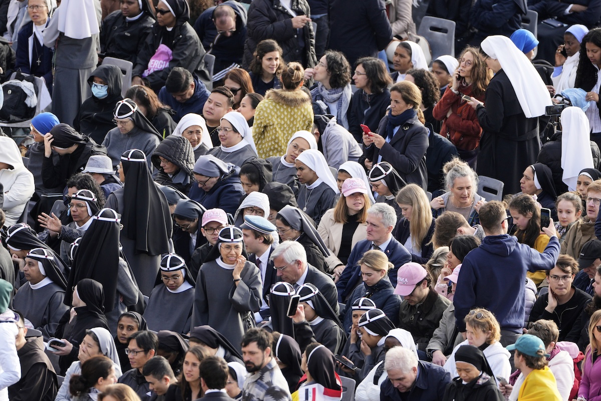 Faithful arrive ahead of the funeral of Pope Francis in St. Peter's Square at the Vatican, Saturday, April 26, 2025. (AP Photo/Markus Schreiber)