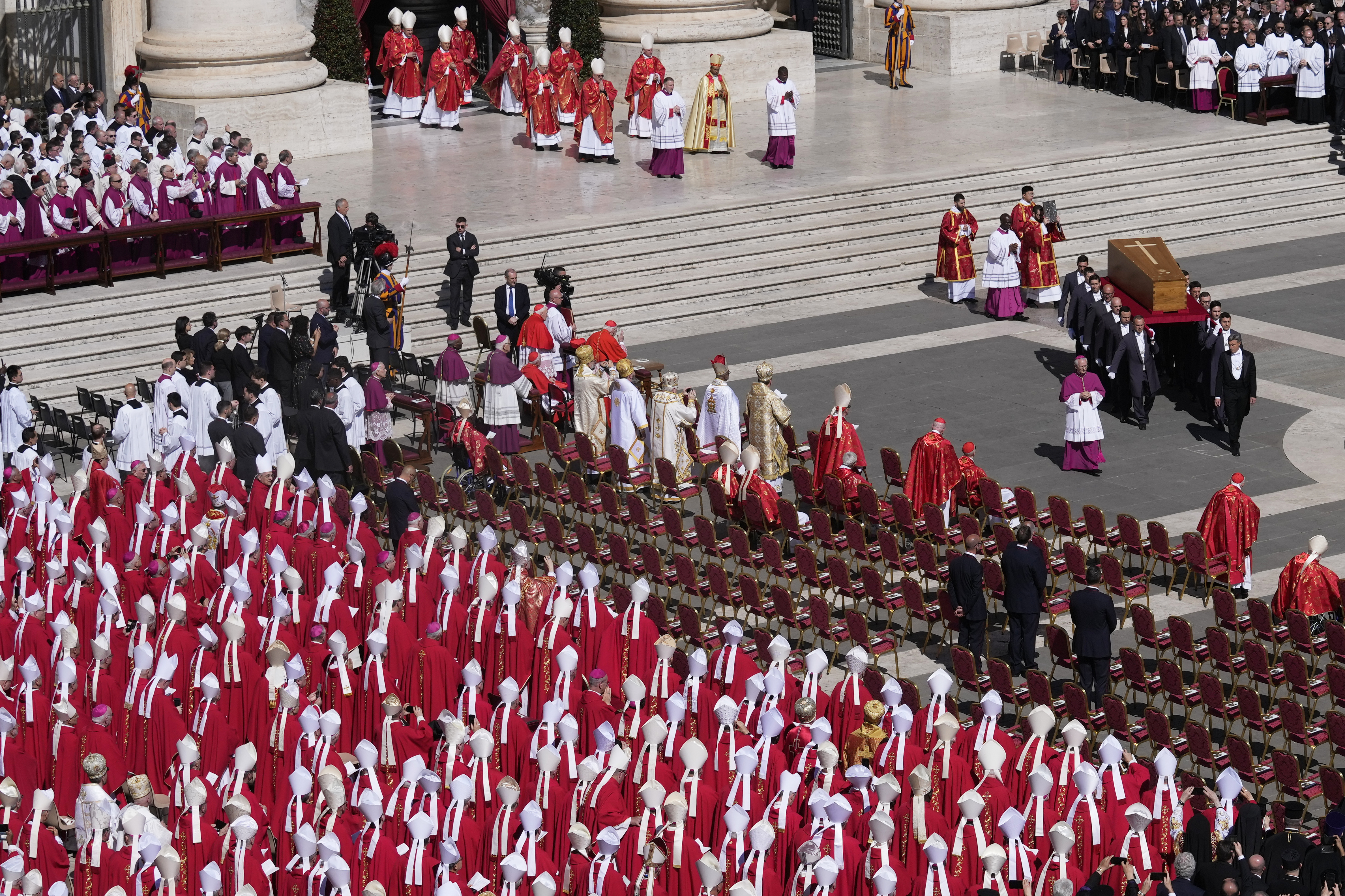 The coffin of Pope Francis is carried into St Peter's Square for his funeral, at the Vatican, Saturday, April 26, 2025. (AP Photo/Gregorio Borgia)