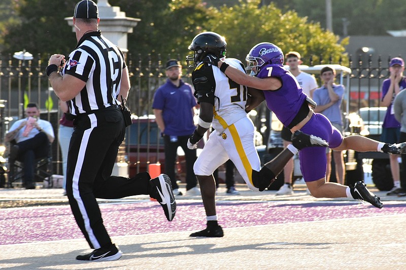 UAPB linebacker Mohammed Kelleh is tackled by Central Arkansas receiver Ty Durham just short of the goal line on a long interception return in the first quarter. (Pine Bluff Commercial/I.C. Murrell)