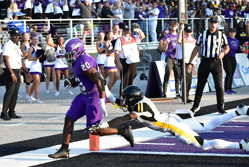 Central Arkansas running back Jalen Washington rushes into the corner of the end zone as he evades a tackle by UAPB cornerback Zach Williams in the first quarter. (Pine Bluff Commercial/I.C. Murrell)