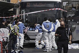 Palestinian gunmen kill 6 people in attack on Jerusalem bus stop ...