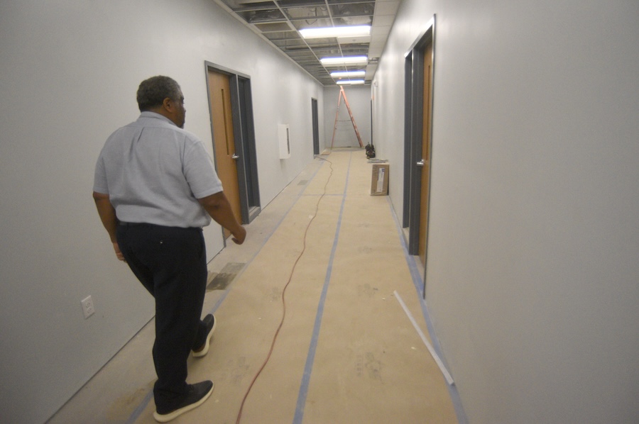 Staff photo by Matt Hamilton/ Architect Reginald Ruff walks down a hallway during a tour of the James A. Henry building on Tuesday, September 23, 2025.