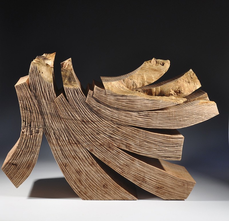 “Continuously Swirling” and “Curled Maple,” maple burl sculptures, and “Fade to Blue” and “Second Chance,” acrylics, rust and charcoal on canvas, by Robyn Horn are on display this month at Justus Fine Art Gallery in Hot Springs.

(Special to the Democrat-Gazette)