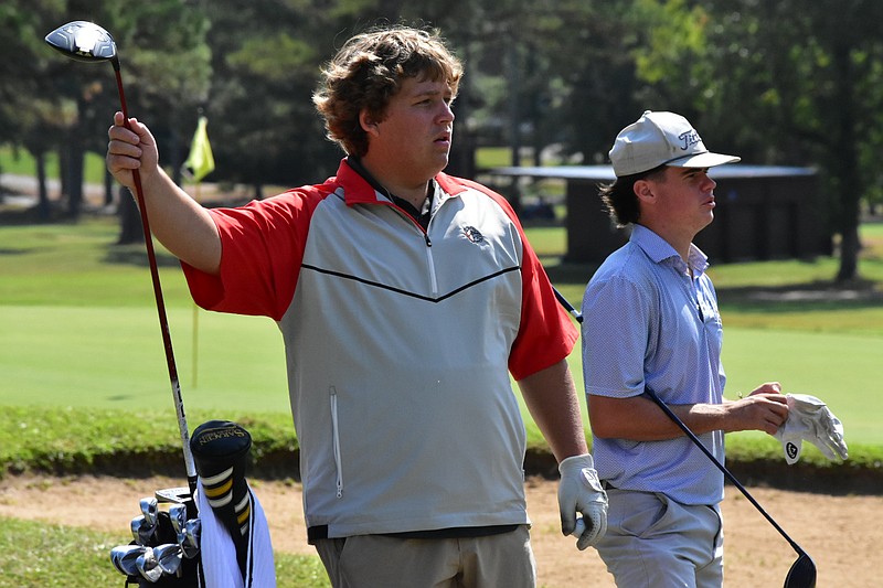 Carson Castaneda of White Hall pulls out his driver as Braxton Blagg of Mountain Home eyes the No. 14 fairway during the 5A state boys golf tournament at the Pine Bluff Country Club on Wednesday, Oct. 8, 2025. (Pine Bluff Commercial/I.C. Murrell)