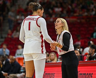 Arkansas’ Maria Anais Rodriguez (1) speaks with Arkansas women’s basketball head coach Kelsi Musick the ball Friday, Nov. 7, 2025 during the second quarter of a basketball game at Bud Walton Arena in Fayetteville. The University of Arkansas Razorbacks hosted the University of Arkansas-Pine Bluff in non-conference play. Visit nwaonline.com/photo for today’s photo gallery. .(NWA Democrat-Gazette/Caleb Grieger)
