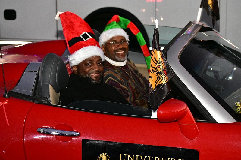 Anthony Graham, chancellor of the University of Arkansas at Pine Bluff, rides as the grand marshal of the Mistletoe Magic Christmas Extravaganza parade as Chris Warrior drives on Saturday, Dec. 6, 2025. (Pine Bluff Commercial/I.C. Murrell)