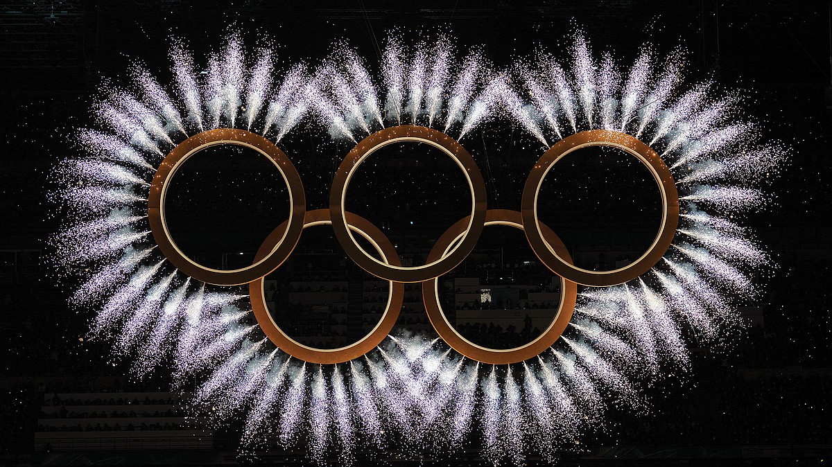 Olympians march in Milan and the mountains in opening ceremony