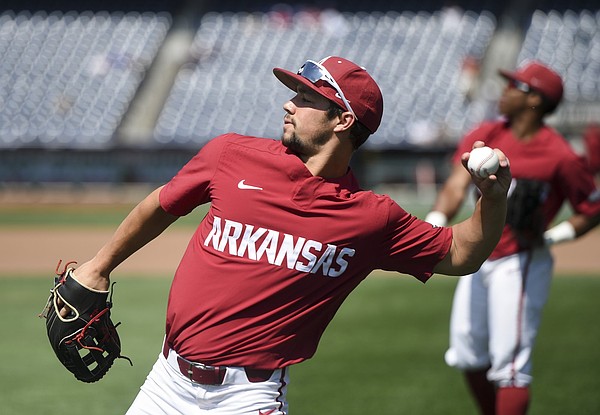 Dominic Fletcher shares defensive tips with Arkansas outfielders ahead of season opener