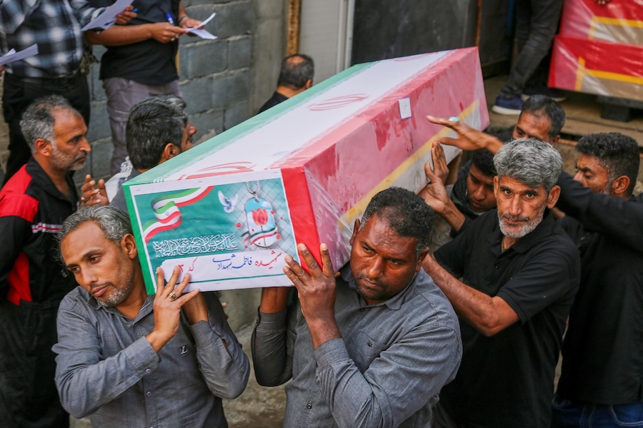 A coffin is carried during the funeral of mostly children killed in a strike Feb. 28 at a girls' elementary school in Minab, Iran, Tuesday, March 3, 2026. (Abbas Zakeri/Mehr News Agency via AP)