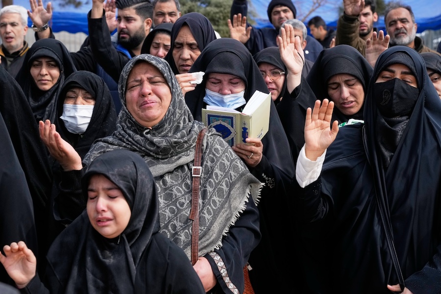 Mourners pray during the funeral of Mehdi Hosseini, a man killed in a U.S.-Israeli strike, at Behesht-e Zahra cemetery in Tehran, Iran, Monday, March 9, 2026. (AP Photo/Vahid Salemi)