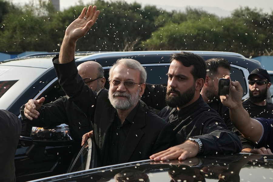 FILE - Ali Larijani, center, head of Iran's National Security Council, gestures as Hezbollah supporters throw rice to welcome him outside Rafik Hariri International Airport in Beirut, Lebanon, Wednesday, Aug. 13, 2025. (AP Photo/Bilal Hussein, File)