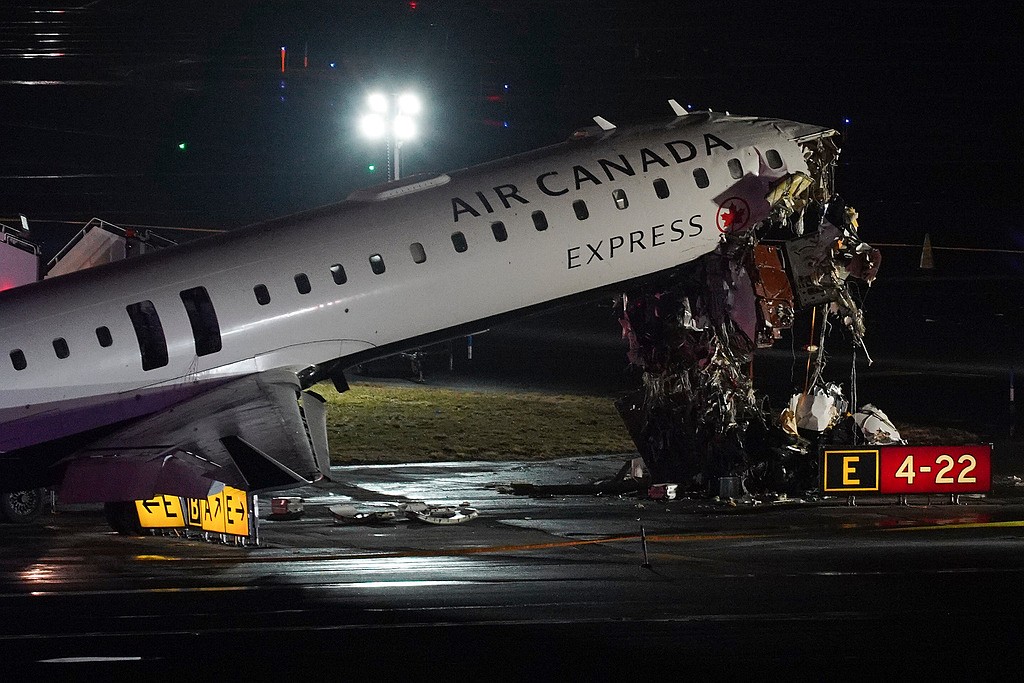 2 pilots killed when jet collides with fire truck at New York's LaGuardia Airport
