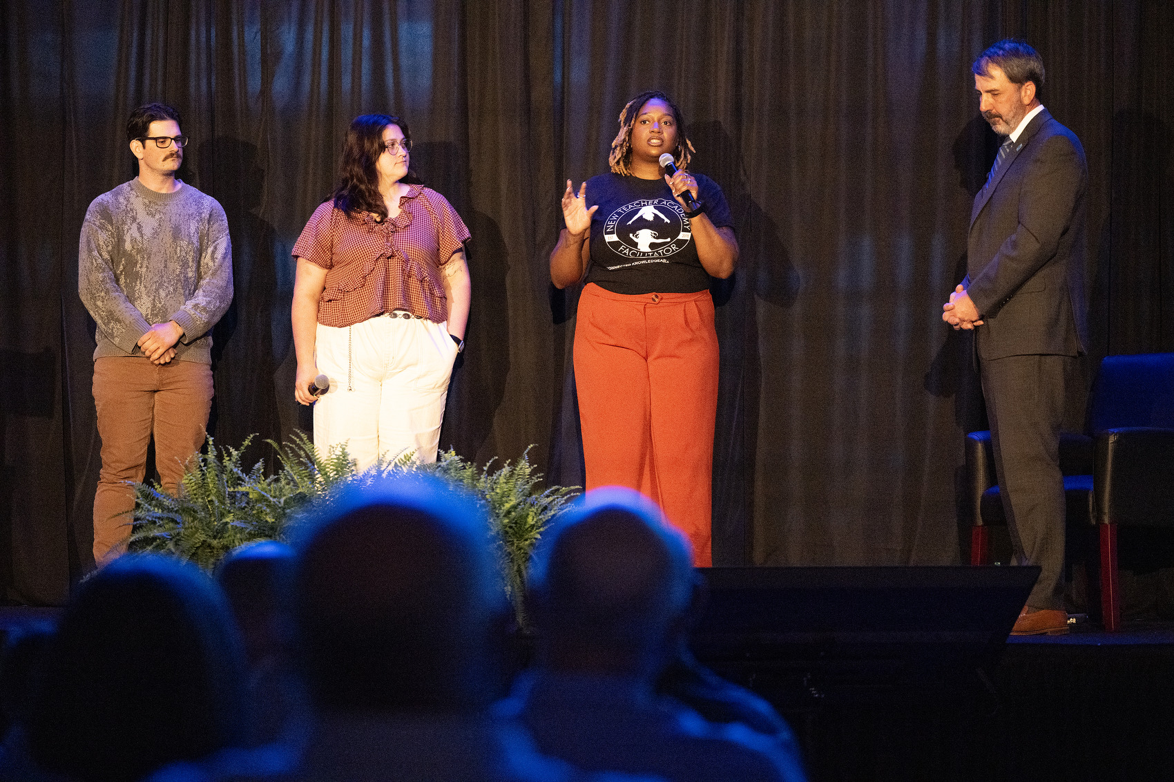 Staff Photo by Seth Carpenter/ Chandler Brooks-Davis speaks alongside her fellow Howard School teachers Kassidy Simmons and Griffen Zemek and Superintendent Justin Robertson at the State of the System for Hamilton County Schools.