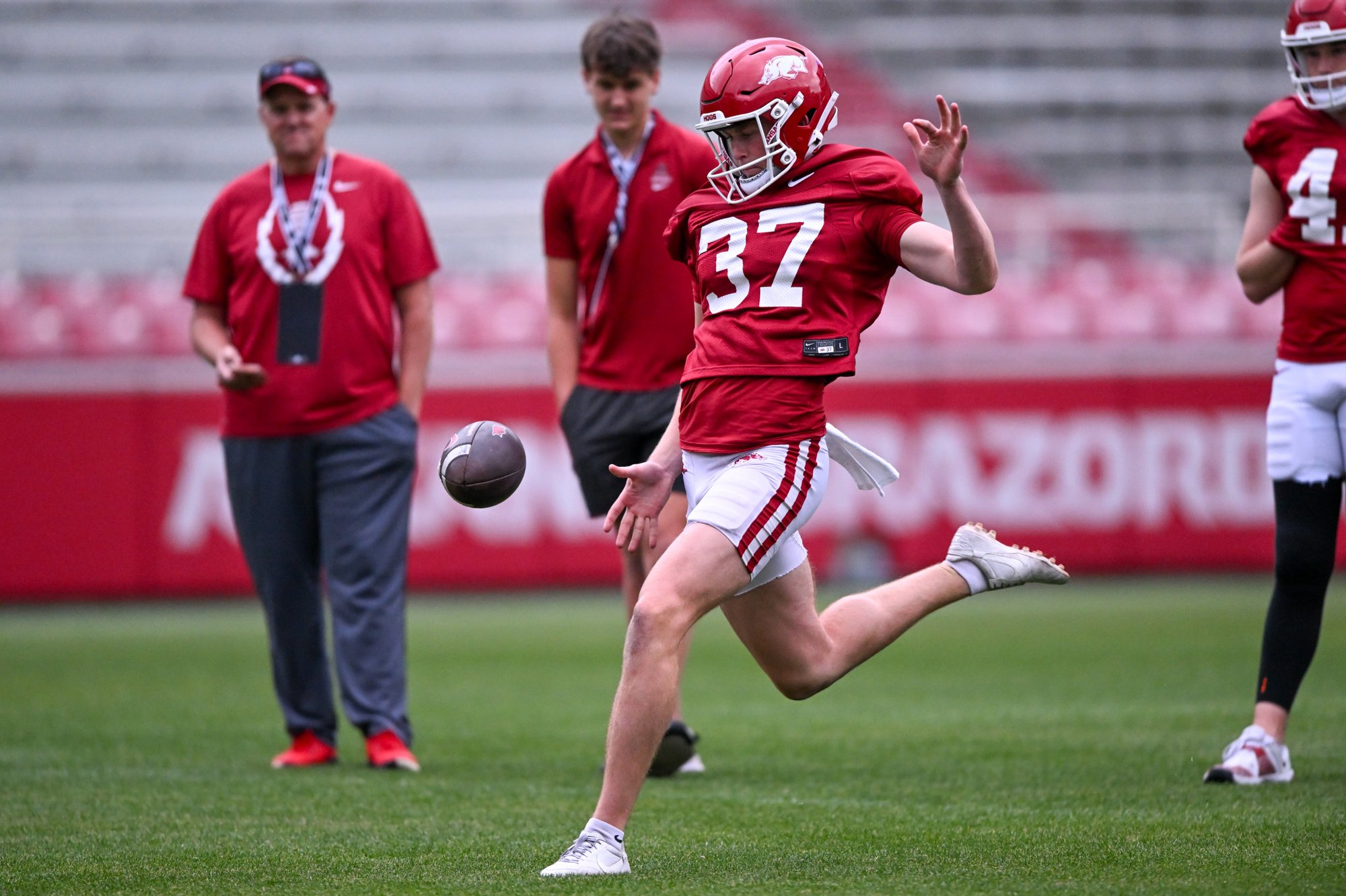 Arkansas special teams coordinator Chad Lunsford working with almost ...
