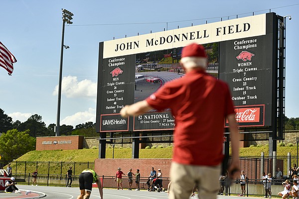 A track official looks on before the start of a race, Saturday, April 11,...