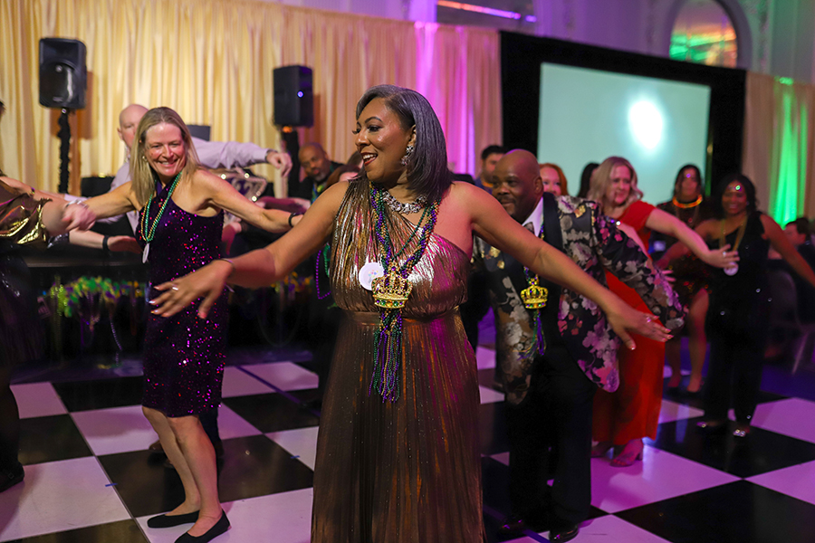 Kimberly Bowen (middle) dances alongside sponsors and guests during a surprise performance of Michael Jackson’s “Thriller.”