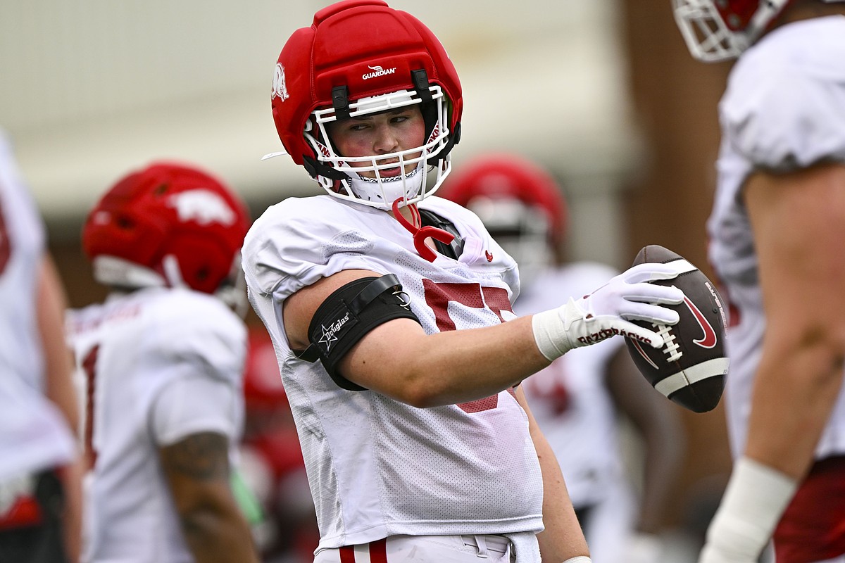 Arkansas football freshman center Carey Clayton learned position from his father, uncles