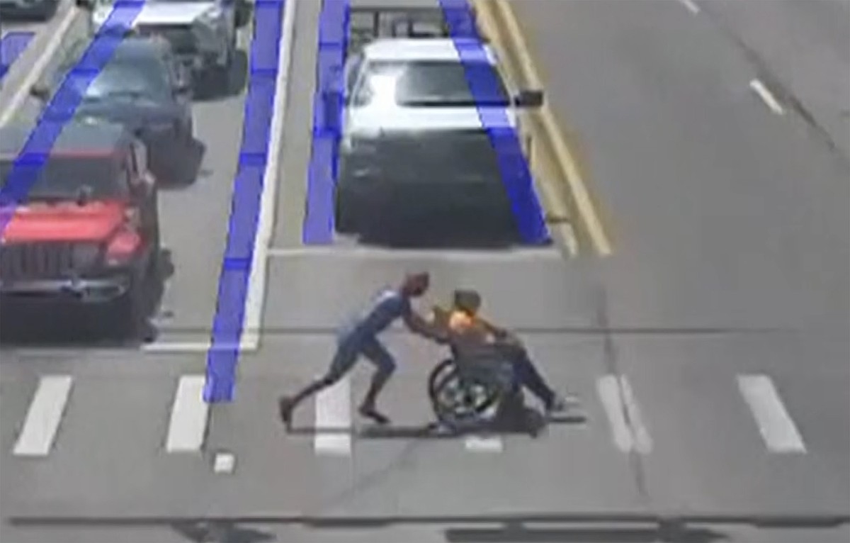 ‘Spider-Man’ superhero jumps to the aid of man using wheelchair to cross several lanes of traffic