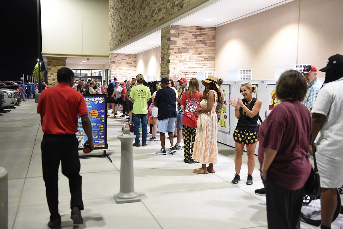 Arkansas' first Buc-ee's opened its doors at 6 a.m. Monday to a cheering crowd of Buc-ee's enthusiasts, excited to get their hands on brisket sandwiches and beaver nuggets.