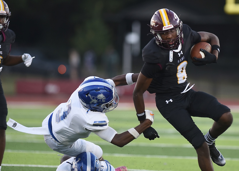 Staff photo by Matt Hamilton / Tyner (9) Dion Edwards carries the ball as Red Bank (3) Dominic Gordon defends during their game at Tyner Academy on Friday, Sept. 4, 2026.