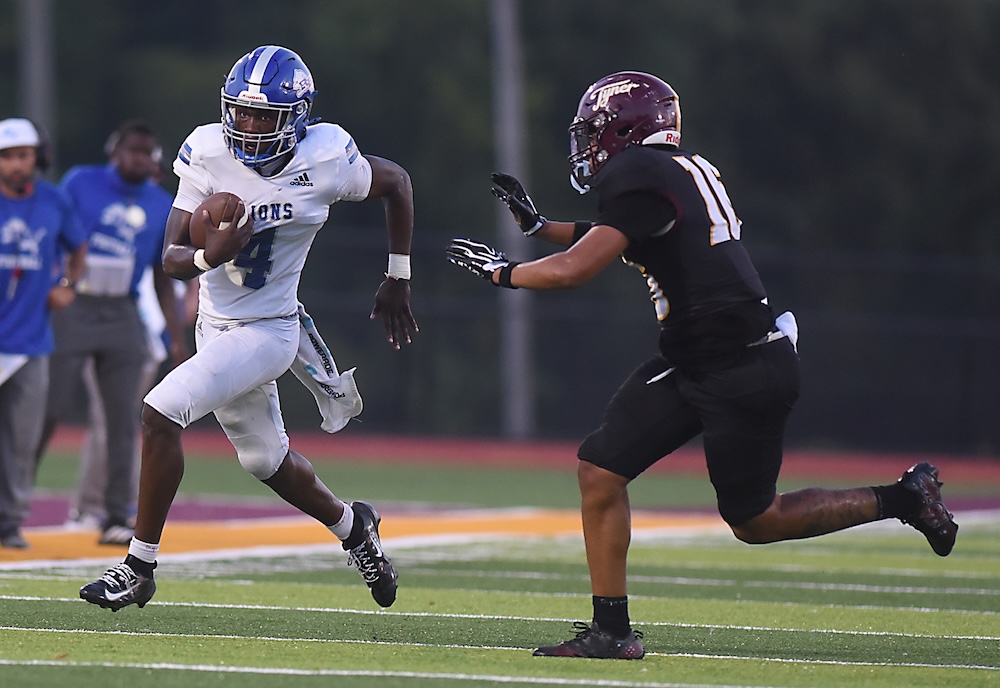 Staff photo by Matt Hamilton / Tyner (16) Nasir Hayward defends as Red Bank (4) Austin Jones carries the ball during their game at Tyner Academy on Friday, Sept. 4, 2026.