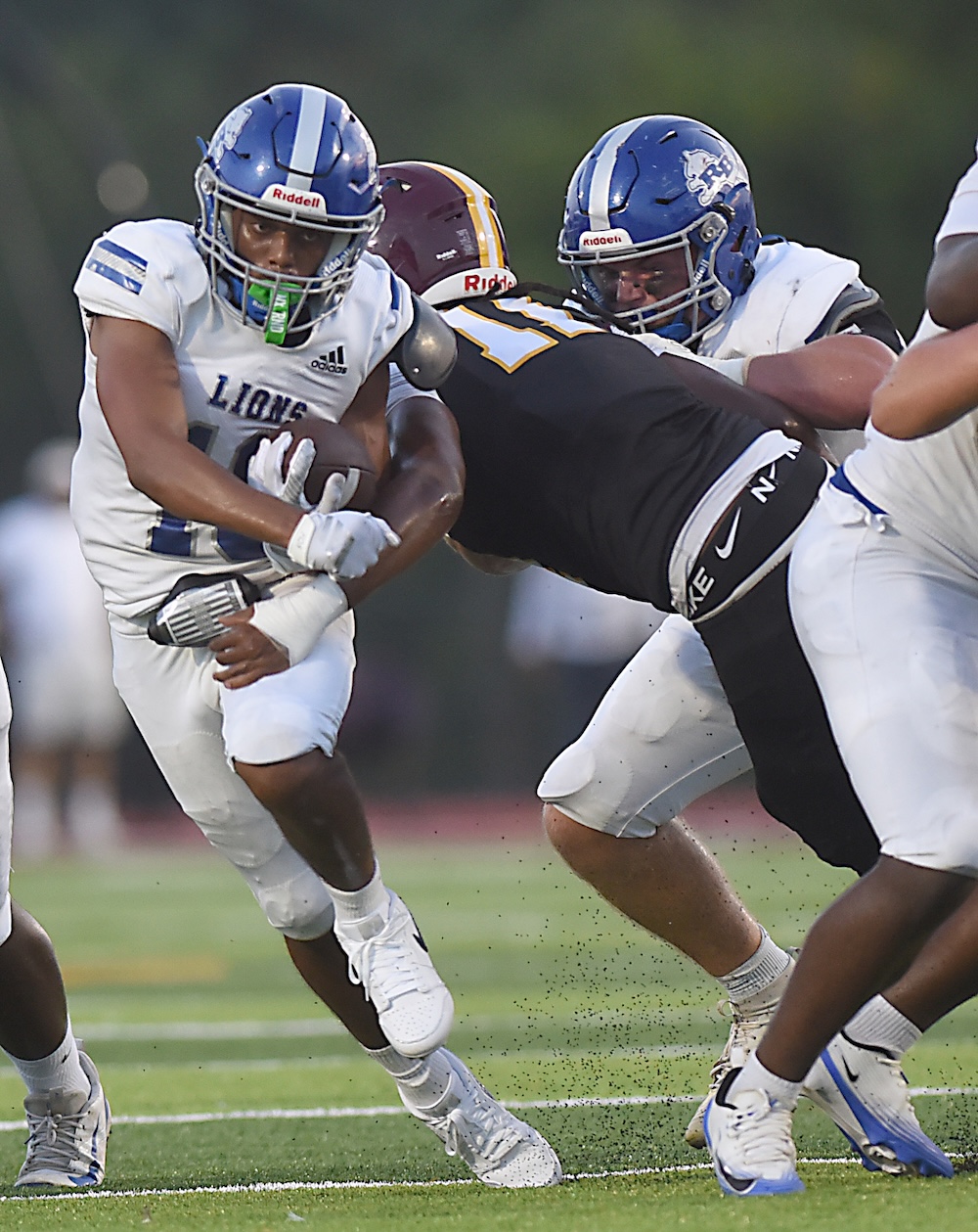 Staff photo by Matt Hamilton / Tyner (11) Ja’Marien Crawl defends as Red Bank (10) Shawn Carter carries the ball during their game at Tyner Academy on Friday, Sept. 4, 2026.