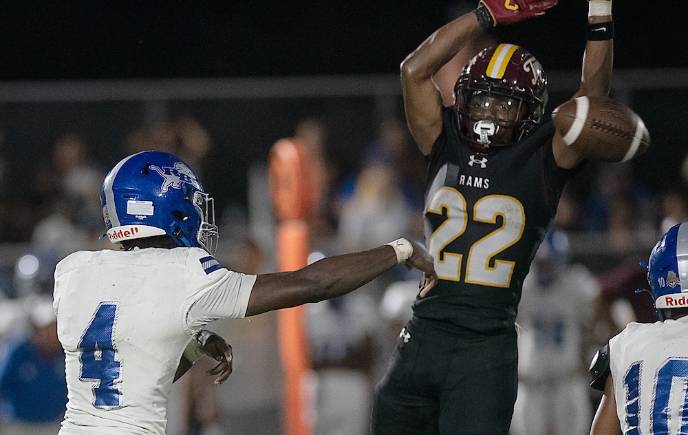 Staff photo by Matt Hamilton / Tyner (22) De’Aerion McNealy attempts to block a pass by Red Bank (4) Austin Jones during their game at Tyner Academy on Friday, Sept. 4, 2026.