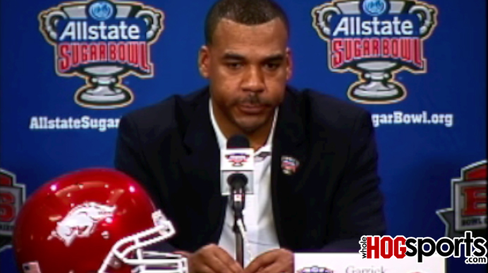 Arkansas offensive coordinator Garrick McGee answers questions during the Sugar Bowl media day for the Razorbacks offense Friday in New Orleans.