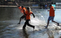 Dozens of participants jumped into a frigid North Little Rock lake as part of an annual polar plunge fundraiser for Special Olympics.