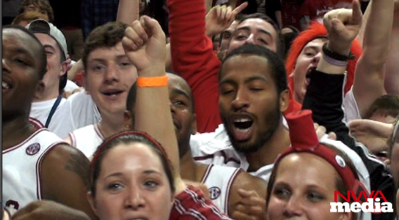 Arkansas players celebrate with students following a 82-74 win over No. 25 Vanderbilt on Tuesday at Bud Walton Arena. 