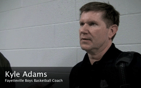 Fayetteville boys basketball coach Kyle Adams is relieved his team pulled through after trailing most of the game at Springdale Har-Ber on Feb. 17, 2012. The Purple'Dogs won, 67-55.