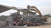 The final stages of the demolition of the Bulldog Gym began Tuesday morning when heavy equipment started cutting into the metal roof and supports.