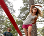 Two slack-line walkers practice Sunday at Lake Willastein Park in Maumelle.