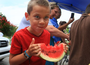 A crowd gathered Sunday for a watermelon festival at Bernice Garden in Little Rock Sunday.
