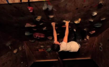 Little Rock resident Kelly Dugan, 24 and one of the climbers in the 2012 LR climbing center's bouldering league, demonstrates a typical bouldering problem.
